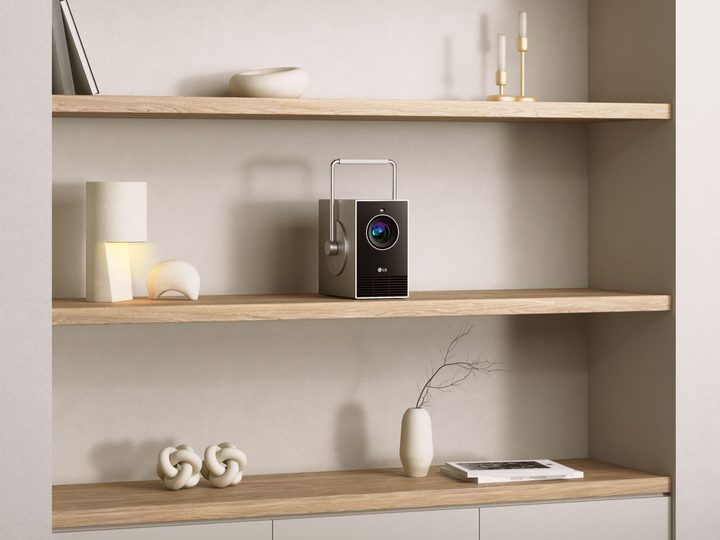 LG CineBeam Q projector on shelf showing its tiny size