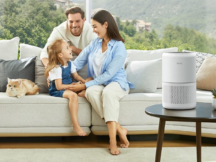 The Levoit Core 300 Air Purifier in the living room with a family.