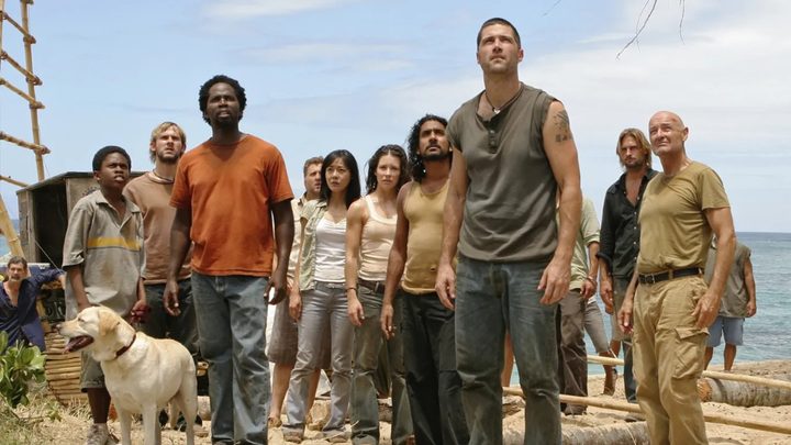 A group of people look up in "Lost."