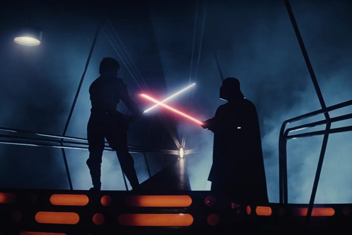 Luke and Darth Vader cross lightsabers in Star Wars: Episode V - Empire Strikes Back.