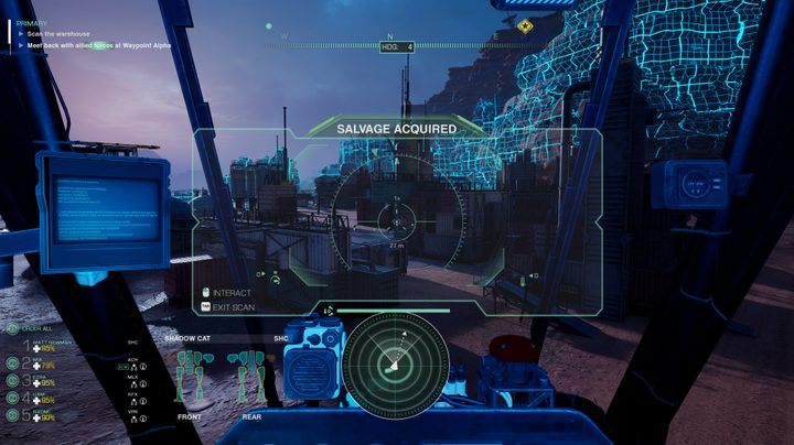 A grid is imposed over a group buildinds in the cockpit view of a mech, indicating that the scanner view is active.
