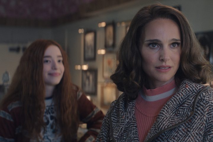 Mikey Madison stands behind Natalie Portman in Lady in the Lake.