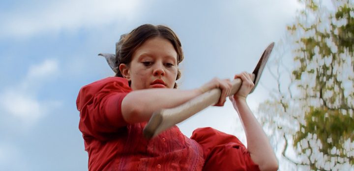 Mia Goth raises an axe in "Pearl."