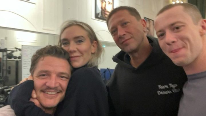 4 actors playing the Fantastic Four pose in a press photo.