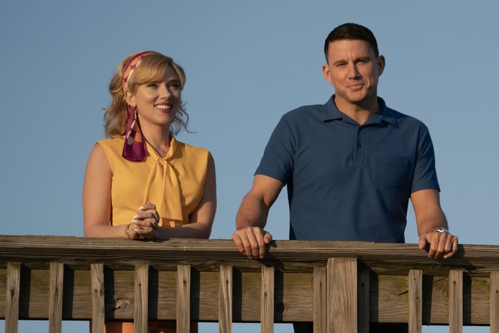 Scarlett Johansson and Channing Tatum lean on a pier railing in Fly Me to the Moon.