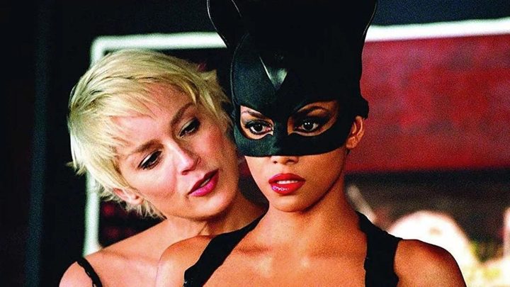 Sharon Stone as Laurel Hedare tapproaching Halle Berry as Catwoman from behind in the 2004 film Catwoman.