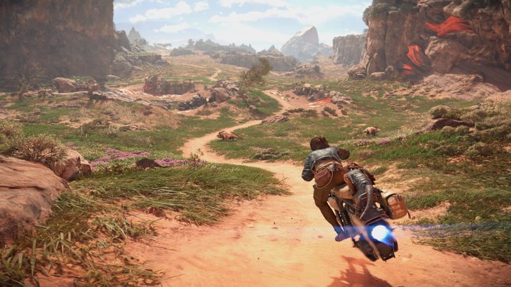 Kay rides her speeder bike.