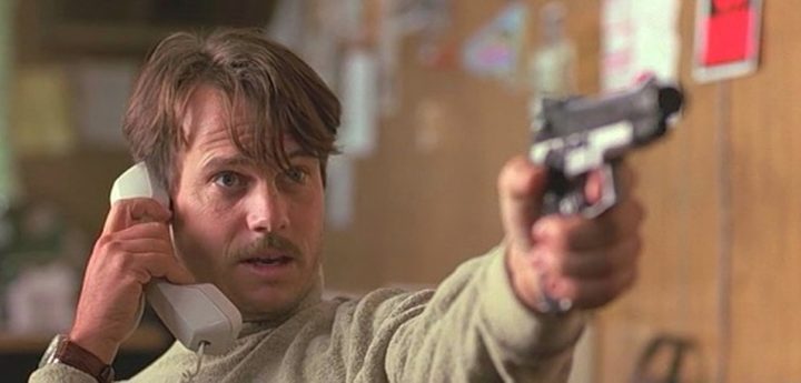 A man points a gun in True Lies.