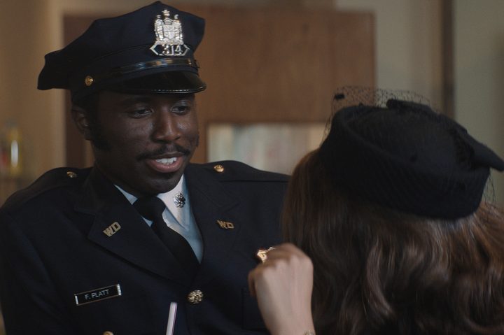 Y'lan Noel smiles at Natalie Portman in Lady in the Lake.