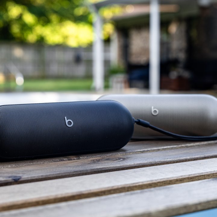 Two Beats Pills sit by a pool.