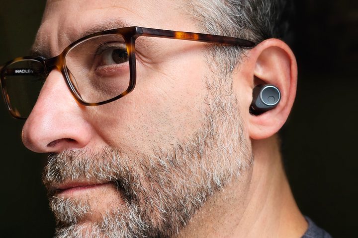 Simon Cohen wearing Cambridge Audio Melomania M100 (side view).