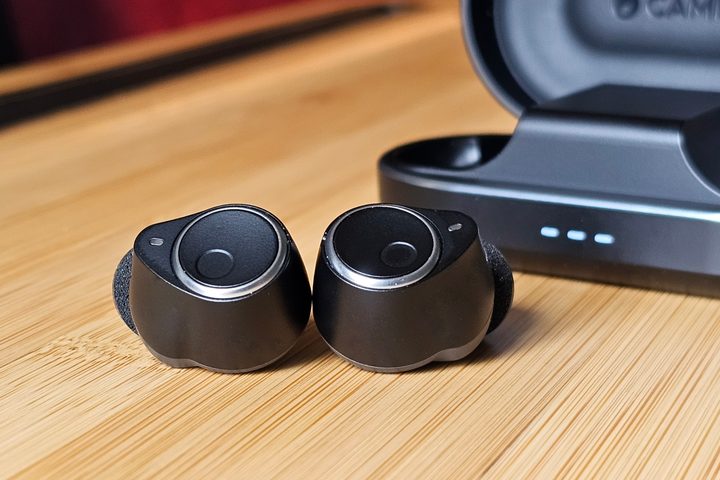 Cambridge Audio Melomania M100: both earbuds in front of charging case.