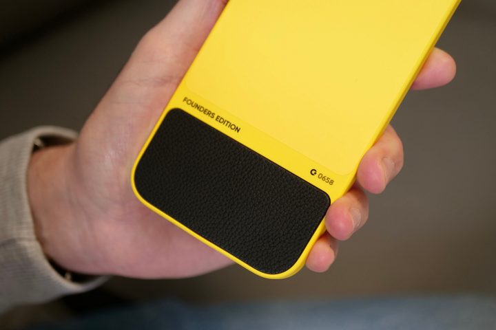 A person holding the iPhone 15 Pro Max inside the Clicks Keyboard case.
