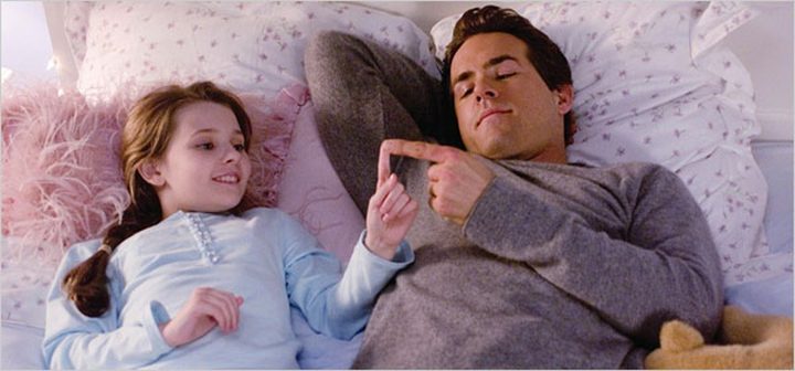 A man and a child join hands in Definitely, Maybe.