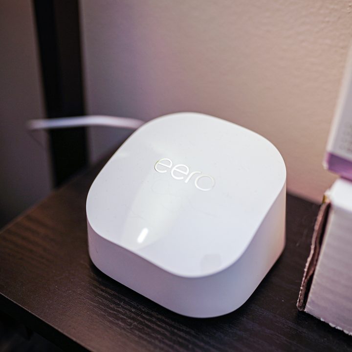 The Eero 6+ router sitting on a desk.