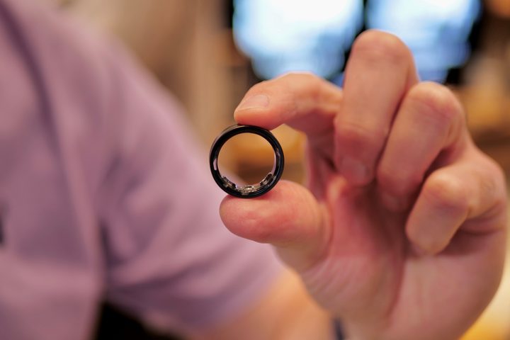 A person holding the Samsung Galaxy Ring.
