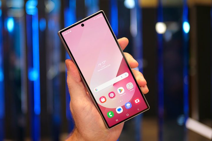 A person holding the closed Samsung Galaxy Z Fold6, showing the Cover Screen.