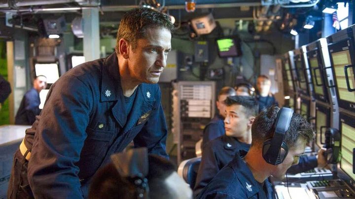 Gerard Butler stands behind his crew.