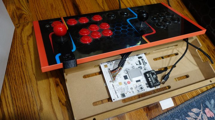 A deconstructed iiRcade cabinet appears on a floor.
