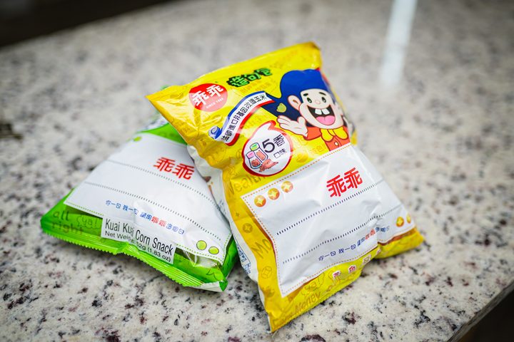 Two packs of Kuai Kuai crisps sitting on top of each other.