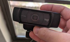 I'm holding my Logitech C920 1080p webcam in my hands.