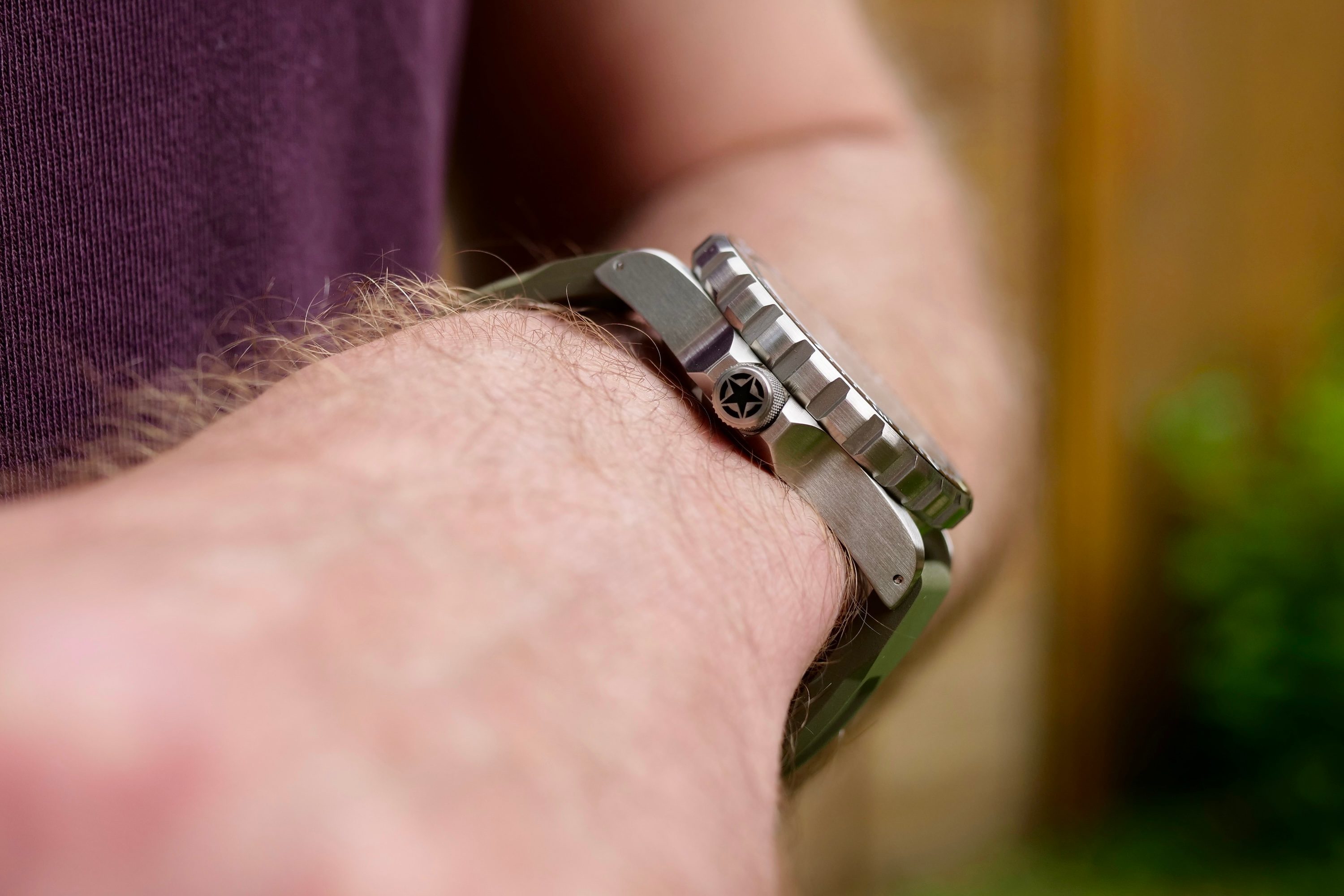 A person wearing the Marathon 41mm Jeep Rubicon GSAR watch.