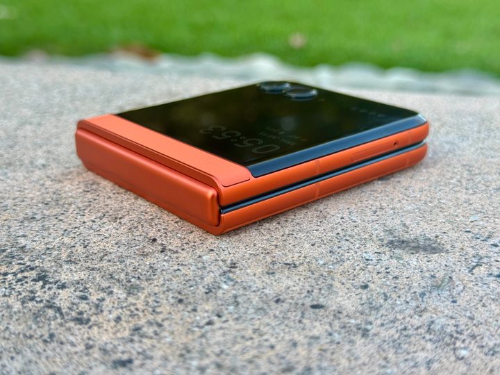 Motorola Razr 2024 in Spritz Orange closed flat angled view.