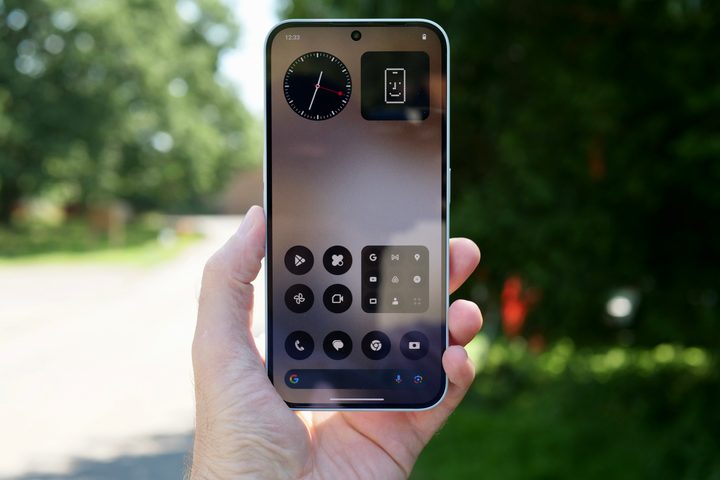 A person holding the Nothing Phone 2a Plus.