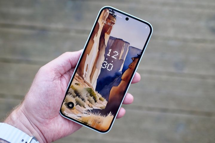A person holding the Nothing Phone 2a Plus.