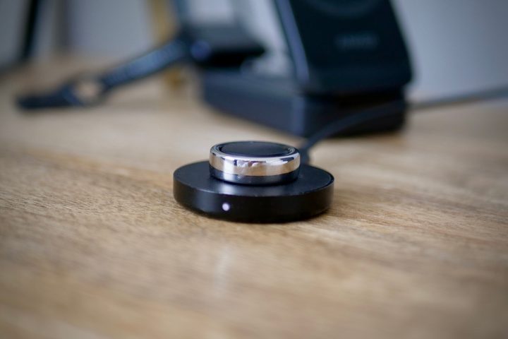 The Oura Ring on its charger.