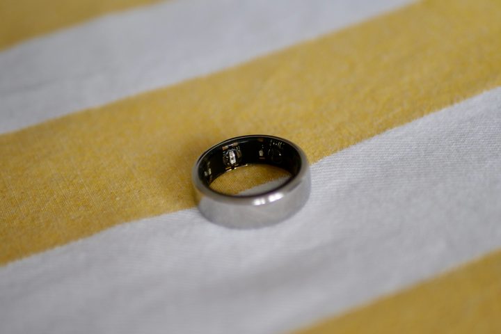 The Oura Ring on a yellow and white background.