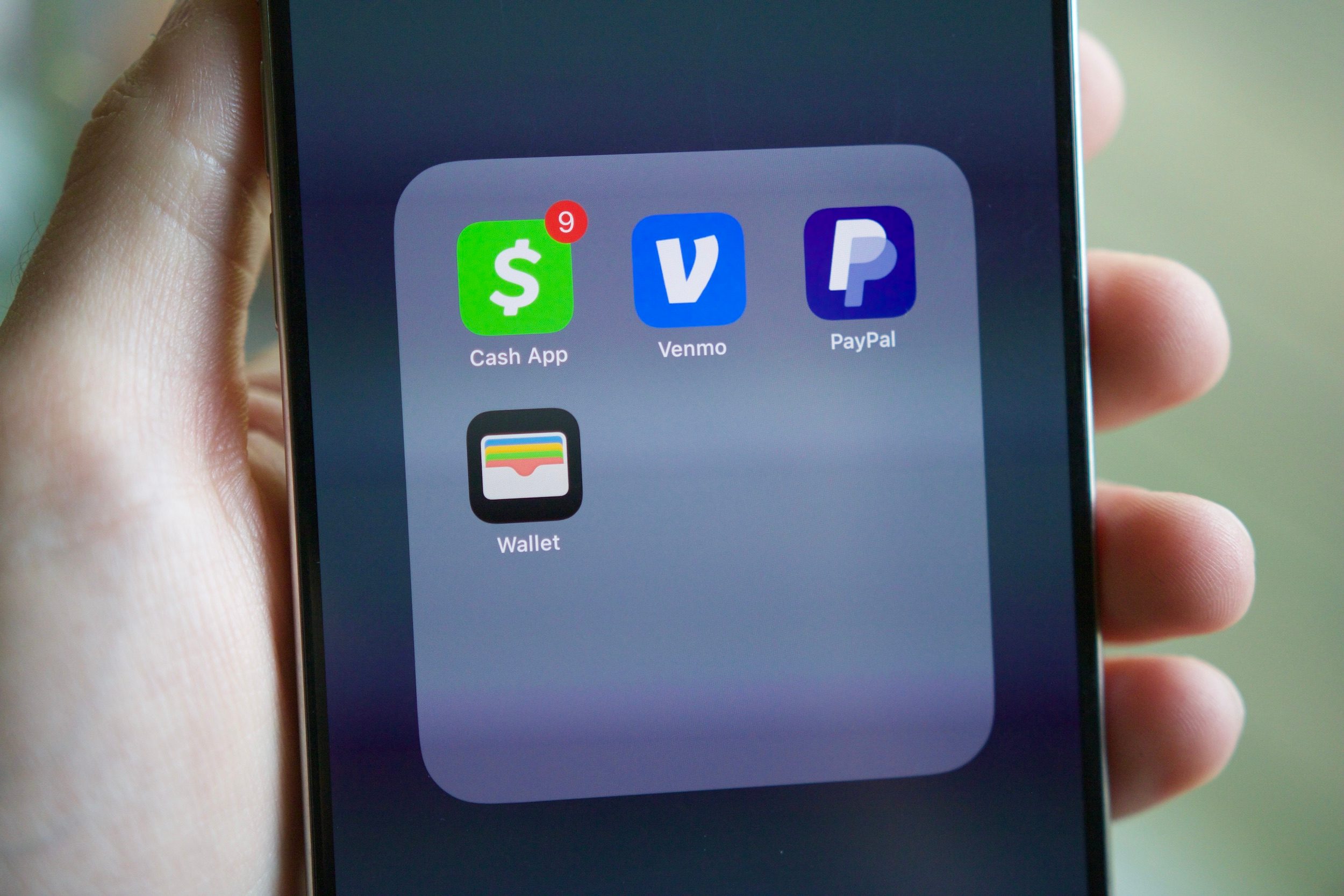 PayPal, Venmo, Cash App, and Apple Wallet apps on an iPhone.