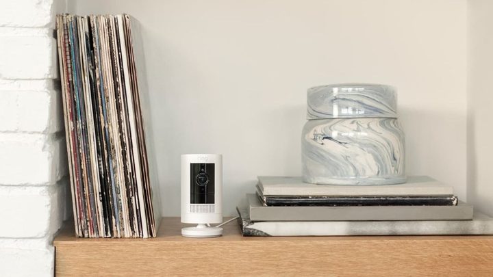 Ring Stick Up Cam Plug-In (3rd Gen) on a shelf.