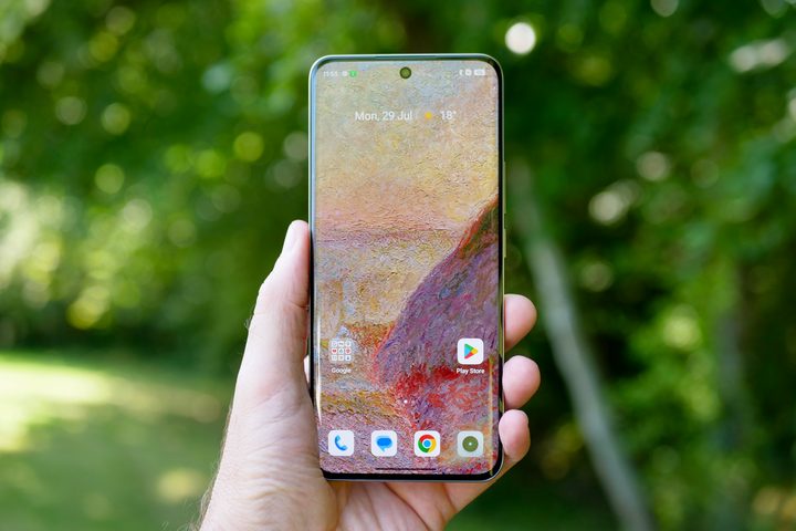 A person holding the Realme 13 Pro+, showing the screen.