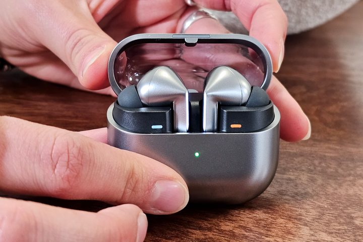 Samsung Galaxy Buds 3 Pro, in case with lid open and blade LEDs lit.
