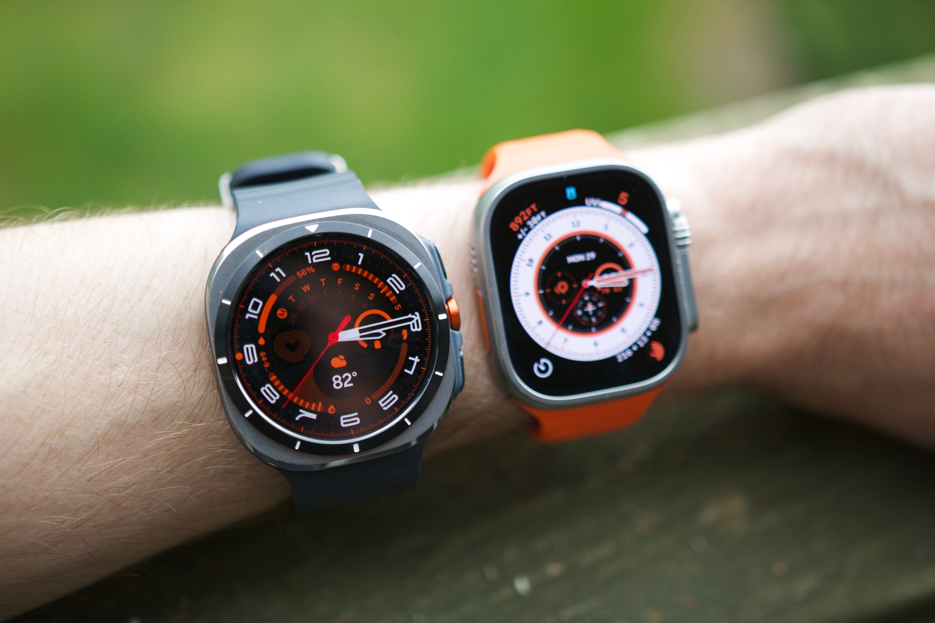 Someone wearing the Samsung Galaxy Watch Ultra and Apple Watch Ultra 2 on the same wrist.