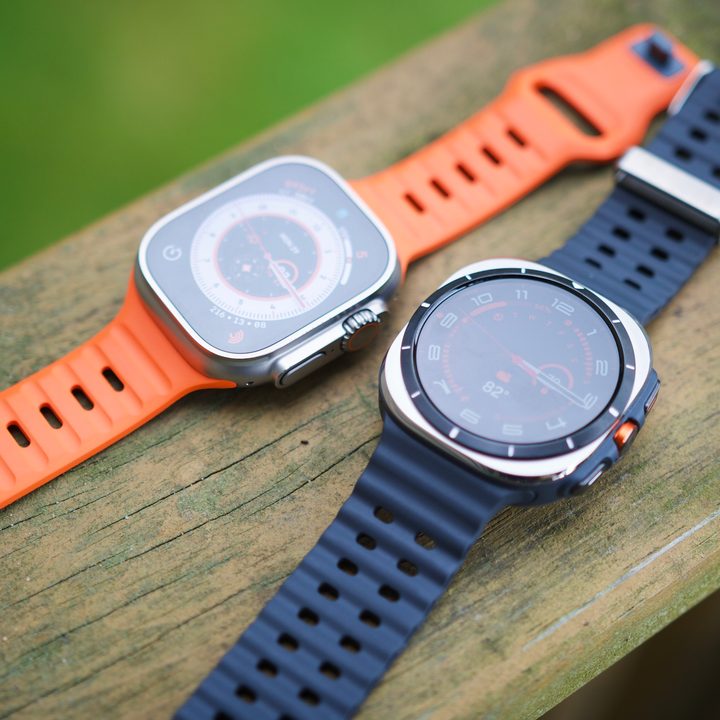 The Samsung Galaxy Watch Ultra and Apple Watch Ultra 2 sitting next to each other.