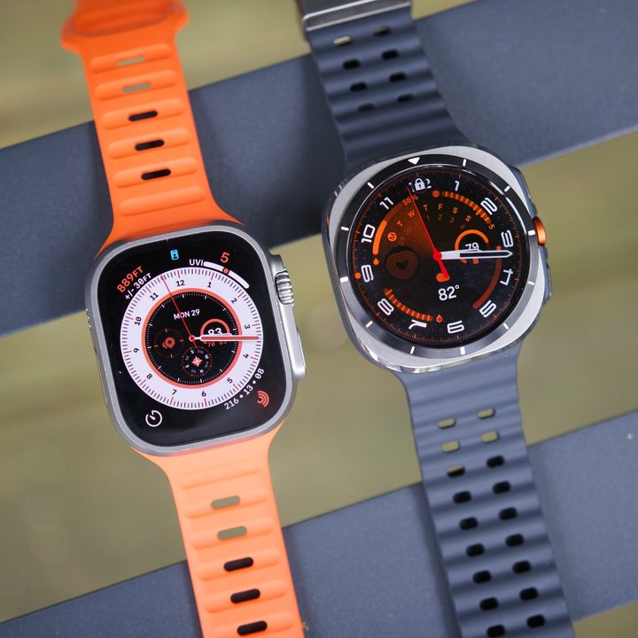 The Samsung Galaxy Watch Ultra and Apple Watch Ultra 2 sitting next to each other.