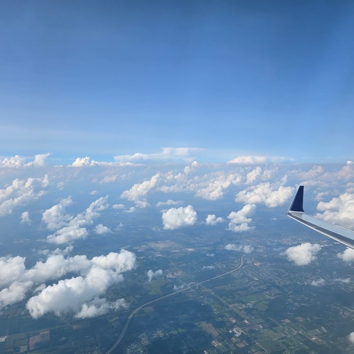 A photo of a sky and an airplane wing, taken with the Samsung Galaxy Z Flip 6.