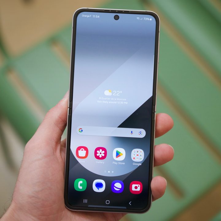 Someone holding the Galaxy Z Flip 6 with the inner display on.