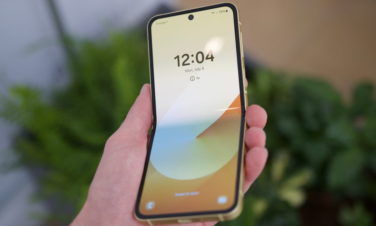 Someone holding the Samsung Galaxy Z Flip 6 with the display open.