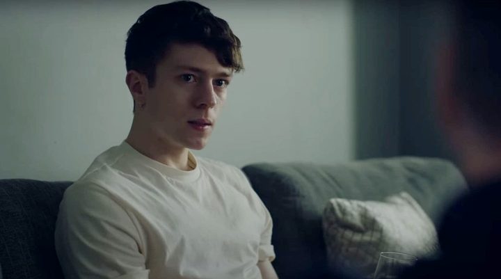 A young man looks over in Sebastian.