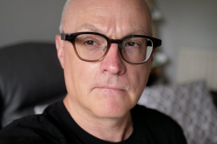 A person wearing the Solos AirGo 3 smart glasses.