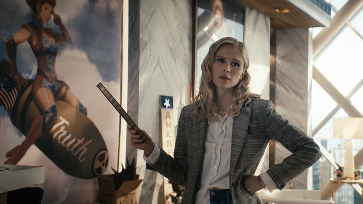 Annie from The Boys with her hand on her hip, a stick in her arm pointing at something.