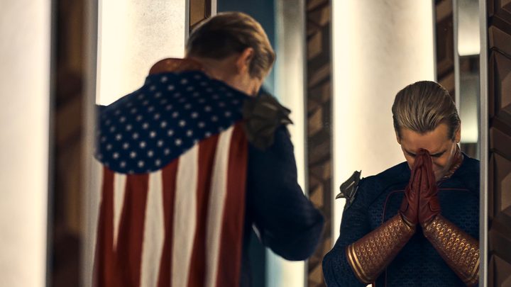 Homelander with his face in his hands looking in the mirror on The Boys.