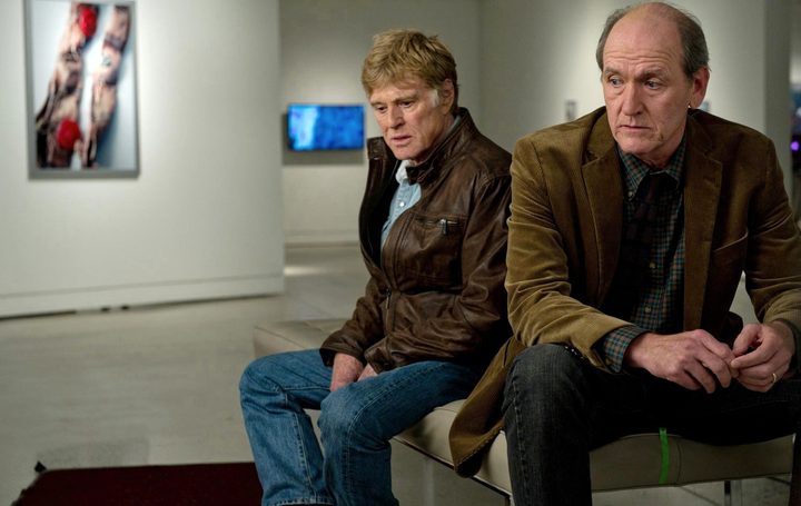 Two men sit in a museum in The Company You Keep.