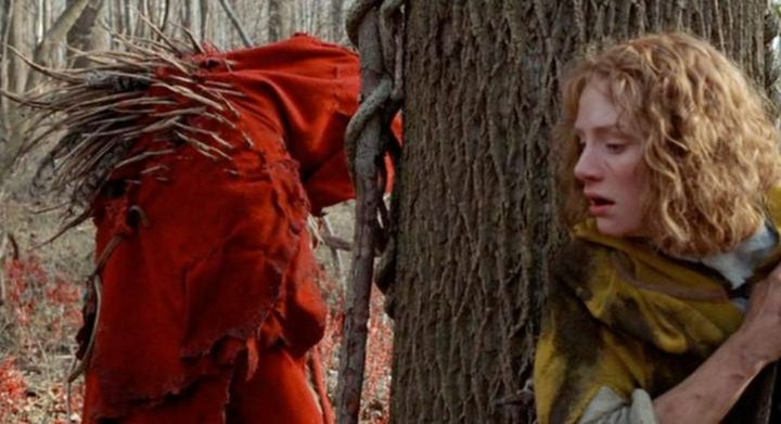 A woman hides from a monster in The Village.