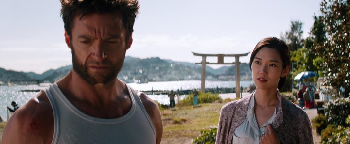 Logan (Hugh Jackman) turns away from Mariko (Tao Okamoto) by a shore in Hiroshima in The Wolverine.