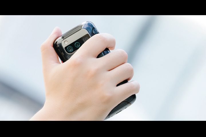 A person holding the Unihertz Jelly Max phone.