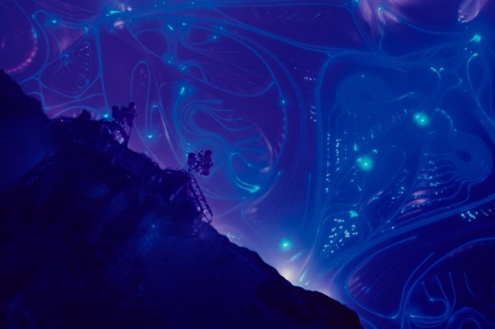 An alien spaceship floats next to an underwater cliffside in The Abyss.